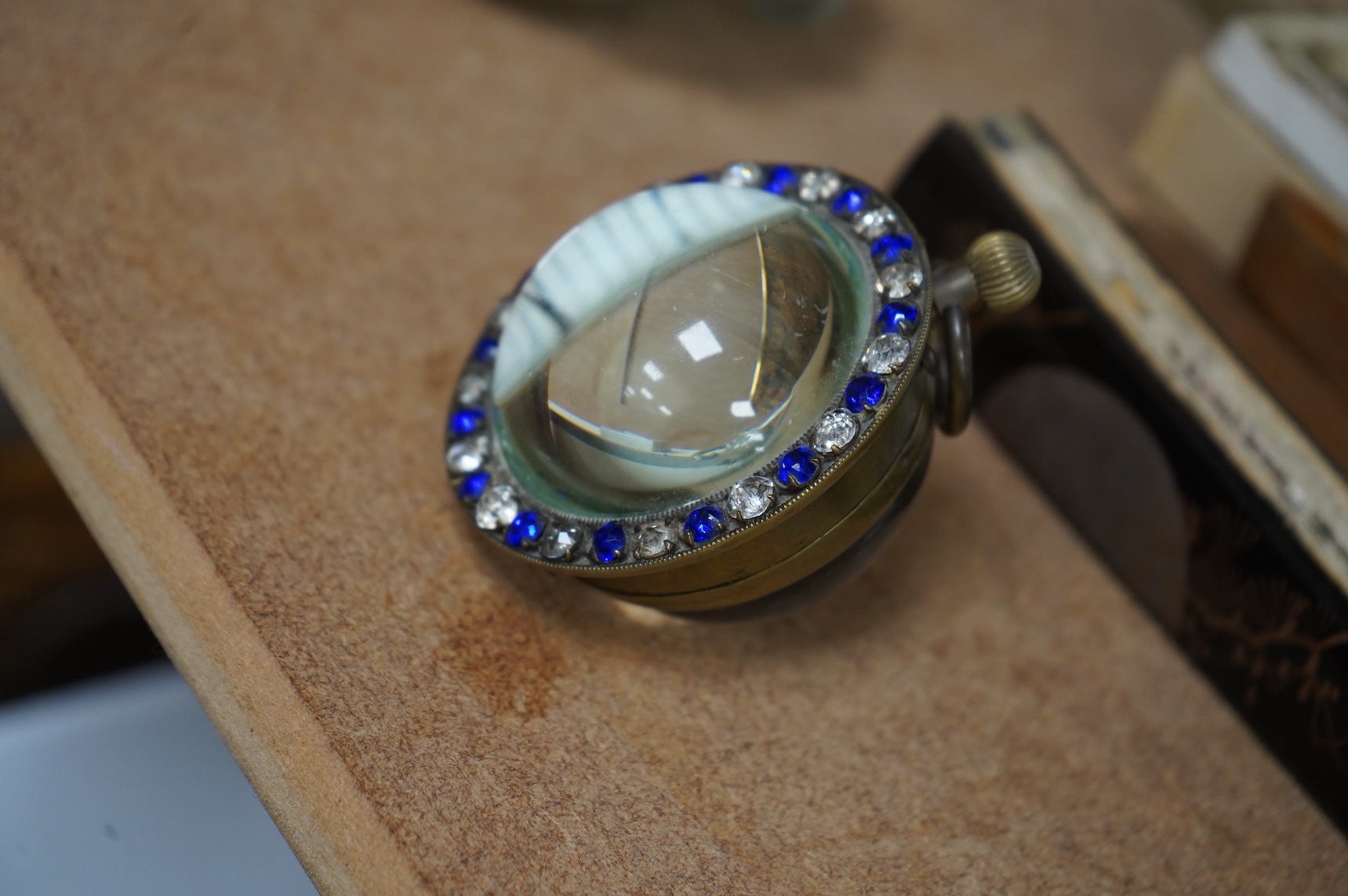 A French paste-mounted globular desk timepiece, 7cm in diameter